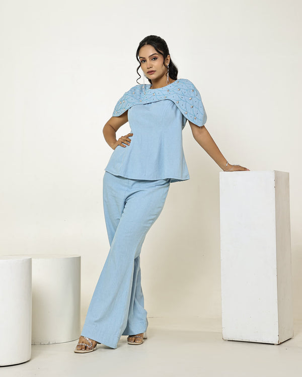 The Light Denim Embellished Cape Peplum Top With High Waisted Flared Pants